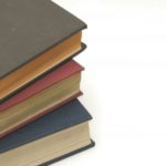 Stack of books on white background